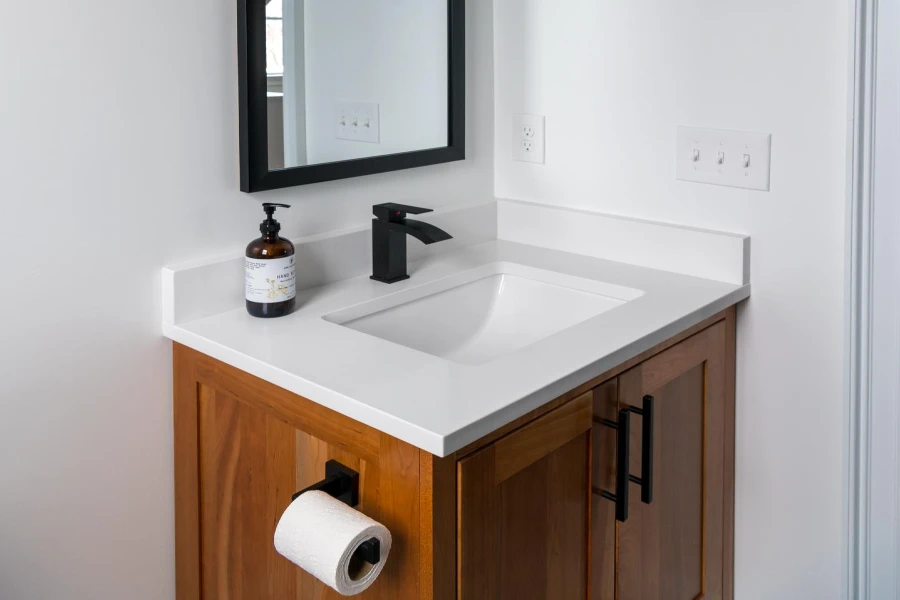 black and white bathroom ideas, black accented mirror, white countertop